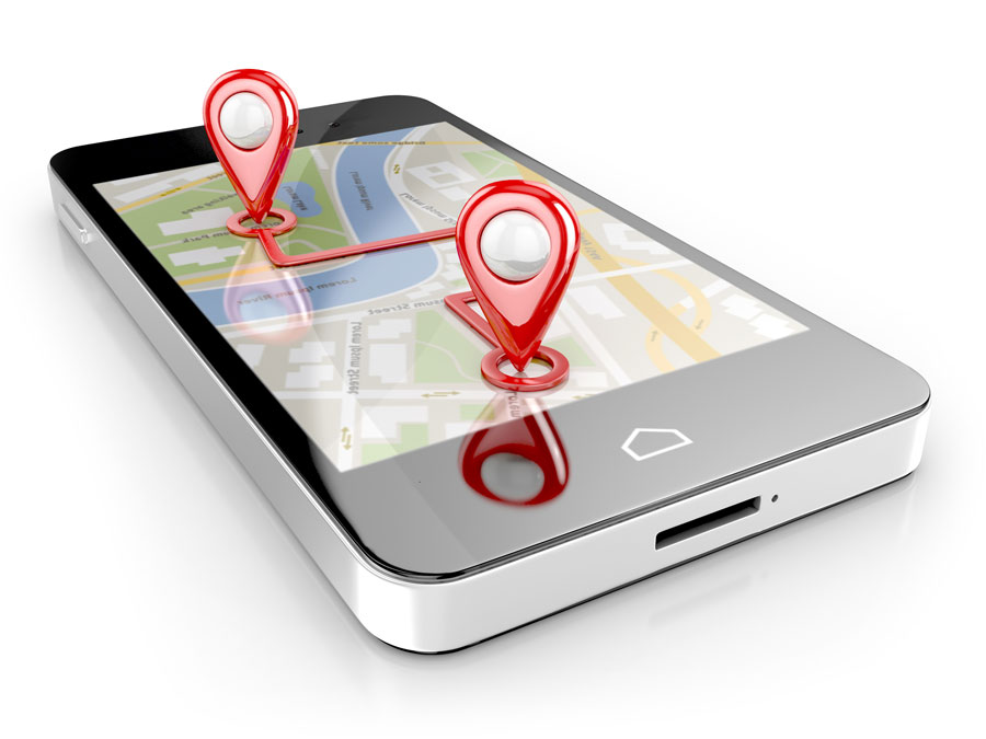 Smartphone displaying map with map pins in 3D sticking out of phone screen